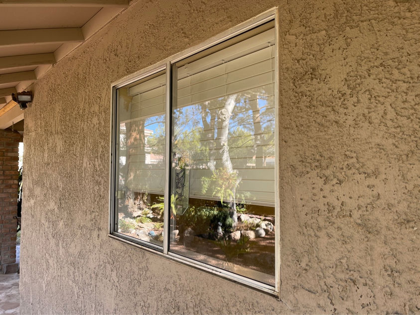 Same Las Vegas sliding window after professional hard water stain removal — crystal clear glass