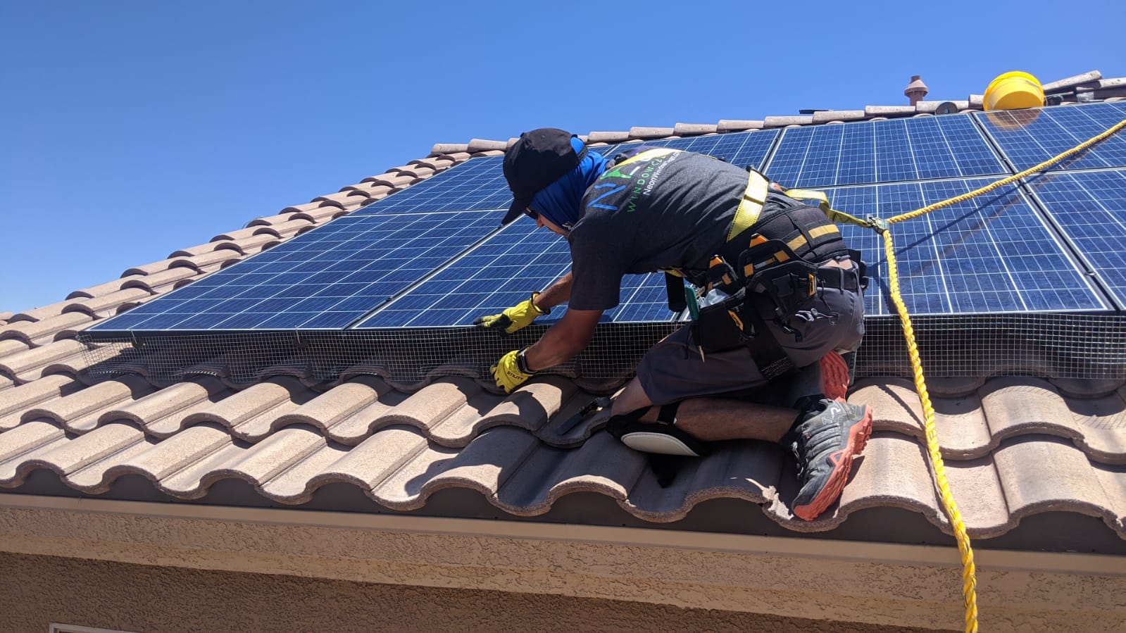 Professional pigeon proofing mesh installed around solar panels on a Henderson estate home