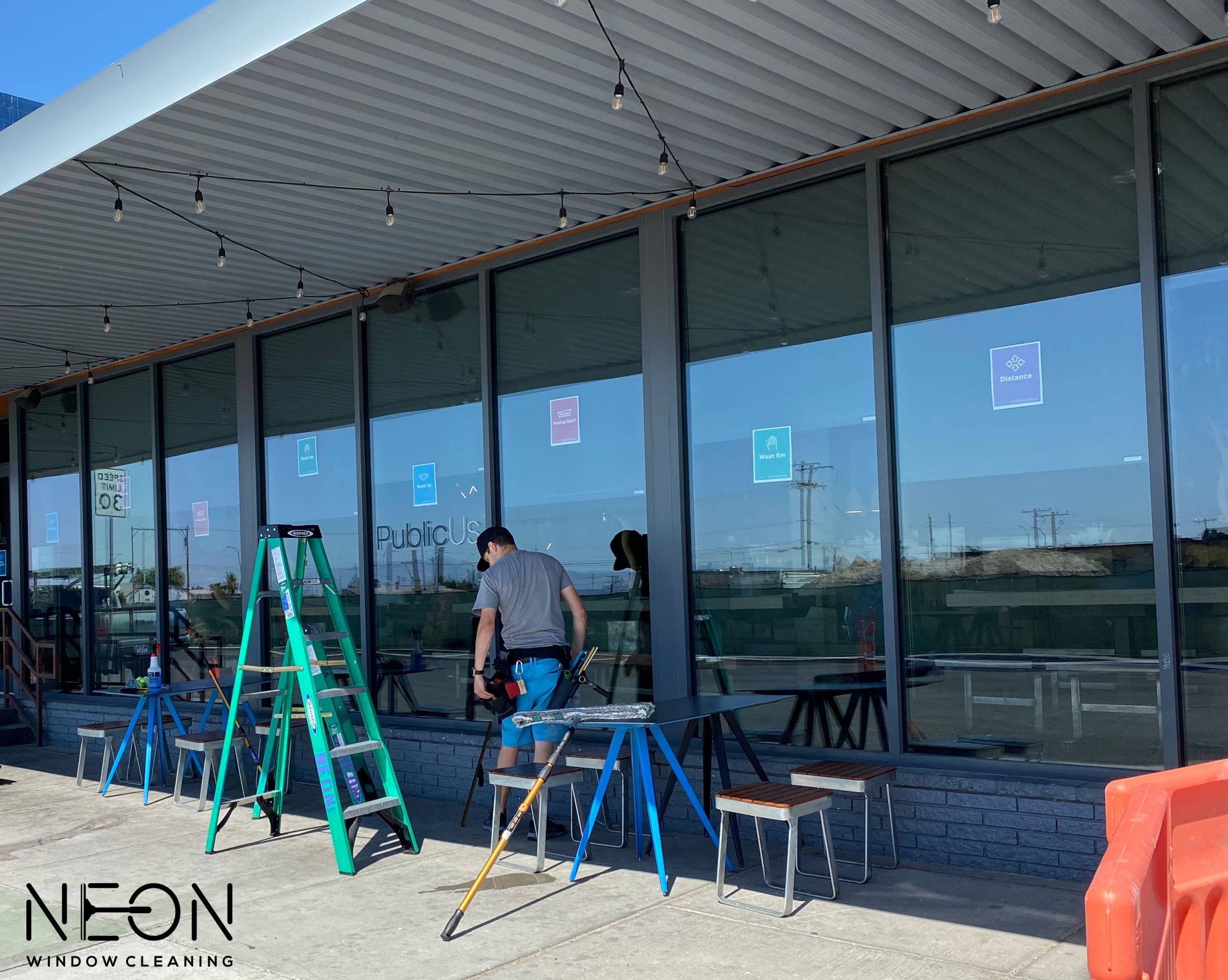 Professional window cleaning on a large two-story Summerlin home with desert landscaping